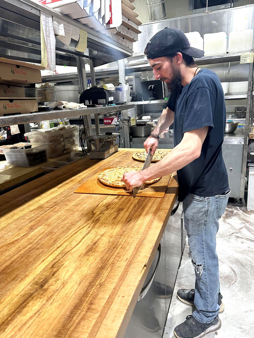 Cutting a fresh pie in the Twin Trees Camillus kitchen