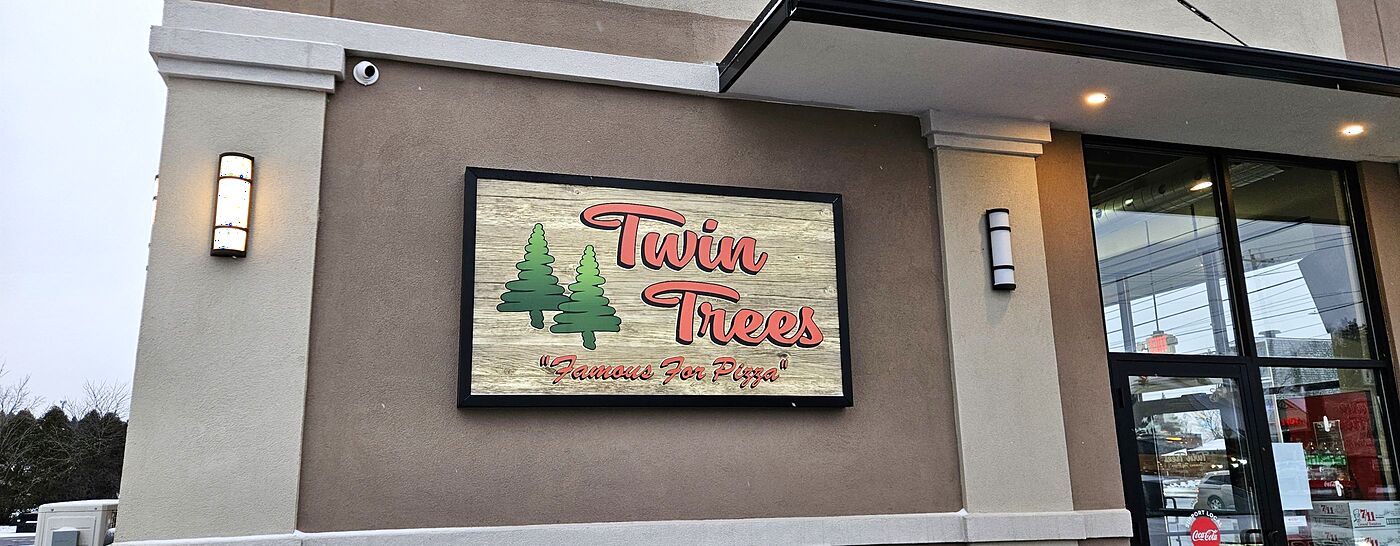 The Twin Trees sign on the Camillus shop